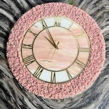Handmade pink resin wall clock with minimalist modern design.