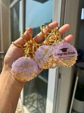 Handmade resin graduation keychain with glossy finish and personalized option.