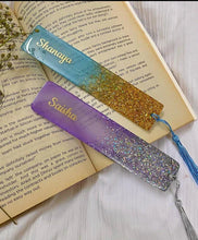 Handmade purple resin bookmark with glitter, gold flakes, and tassel