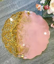 Handmade resin coaster with pink and gold leaf design in two colours.