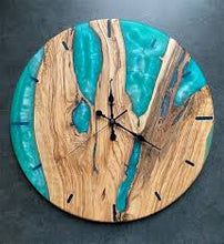 Teal resin and olive wood wall clock with modern handmade design.