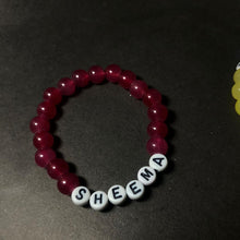 Customized color name bracelet in vibrant red